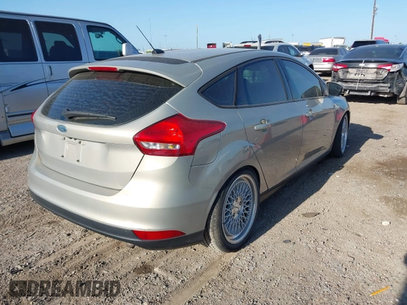 2015 Ford Focus SE with VIN 1FADP3K23FL261021, listed as a IAAI auction lot 42014802 with 157,283 mi miles. Bid and sale history available at carsss.com. Image 4.