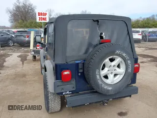 2005 Jeep Wrangler Sport with VIN 1J4FA49S05P384308, listed as a IAAI auction lot 41821354 with 106,394 mi miles. Bid and sale history available at carsss.com. Image 3.