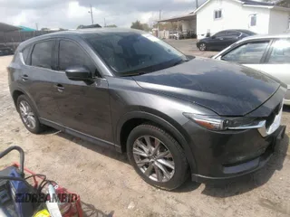 2019 Mazda CX-5 Grand Touring with VIN JM3KFBDM7K0606860, listed as a IAAI auction lot 41936338 with 93,057 mi miles. Bid and sale history available at carsss.com. Image 1.