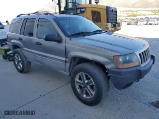 1999 Jeep Grand Cherokee Laredo with VIN 1J4GW58N9XC730311, listed as a Copart auction lot 77774544 with 0 mi miles and Salvage Title. Bid and sale history available at carsss.com. Image 4.