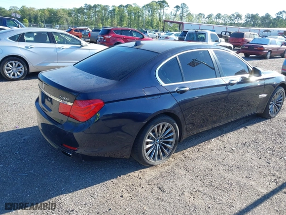 2011 BMW 7 Series 740i with VIN WBAKA4C52BC392112, listed as a IAAI auction lot 41736939 with 125,953 mi miles. Bid and sale history available at carsss.com. Image 4.