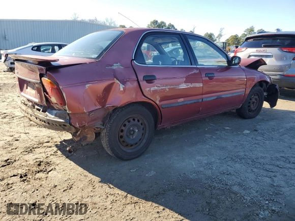 2001 Suzuki Esteem GL z VIN JS2GB41S915202412, wystawiony jako Copart lot #88372235 z przebiegiem 301 061 mil mil oraz Szkoda całkowita • Salvage title. Historia ofert i sprzedaży dostępna na DreamBid. Obrazek 3.