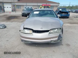 1999 Oldsmobile Aurora z VIN 1G3GR62C5X4114285, wystawiony jako IAAI lot #42271517 z przebiegiem 308 731 mil mil oraz . Historia ofert i sprzedaży dostępna na DreamBid. Obrazek 12.