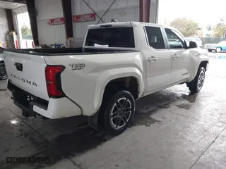 2024 Toyota Tacoma 4WD SR5 with VIN 3TMLB5JN8RM035278, listed as a IAAI auction lot 41789088 with 10,695 mi miles. Bid and sale history available at carsss.com. Image 4.