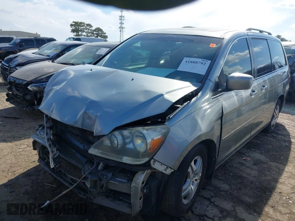 2007 Honda Odyssey EX-L with VIN 5FNRL38677B054173, listed as a IAAI auction lot 41888792 with 142,438 mi miles and . Bid and sale history available at DreamBid. Image 2.