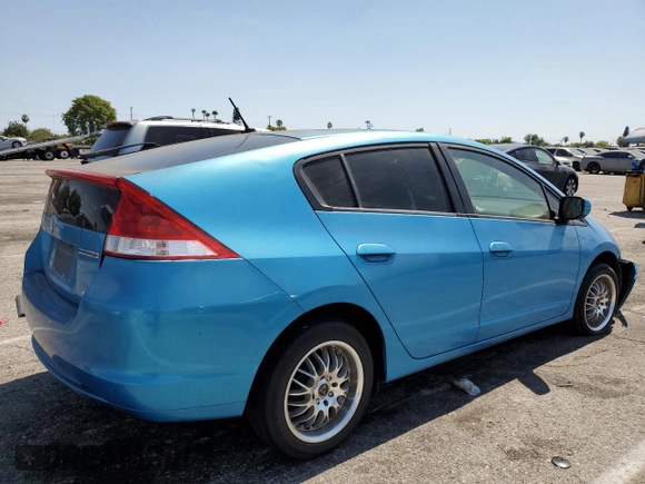 2010 Honda Insight LX with VIN JHMZE2H51AS028849, listed as a Copart auction lot 65547805 with 209,316 mi miles and Salvage title. Bid and sale history available at DreamBid. Image 3.