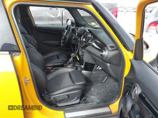 2016 MINI Hardtop 4 Door z VIN WMWXU1C56G2D10006, wystawiony jako IAAI lot #41752731 z przebiegiem 67 844 mil mil oraz . Historia ofert i sprzedaży dostępna na DreamBid. Obrazek 5.