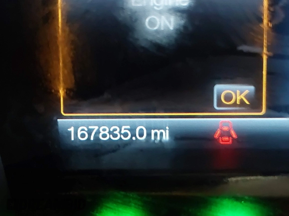 2014 Lincoln MKS with VIN 1LNHL9EK5EG605750, listed as a IAAI auction lot 41565308 with 167,835 mi miles. Bid and sale history available at carsss.com. Image 7.