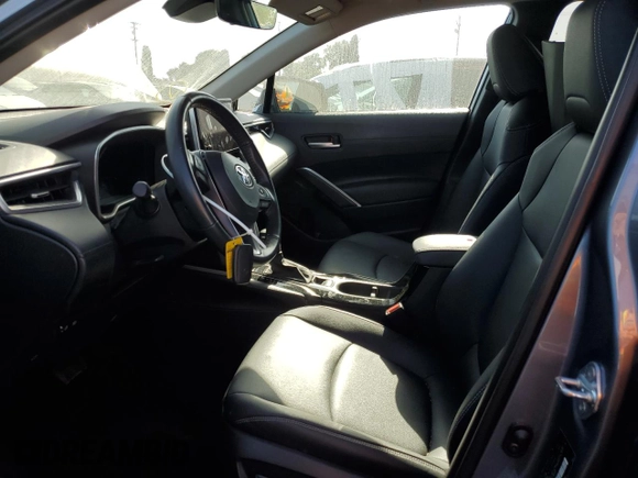 2023 Toyota Corolla Cross XLE with VIN 7MUDAAAG0PV063242, listed as a Copart auction lot 52511585 with 10,695 mi miles and Salvage title. Bid and sale history available at DreamBid. Image 7.