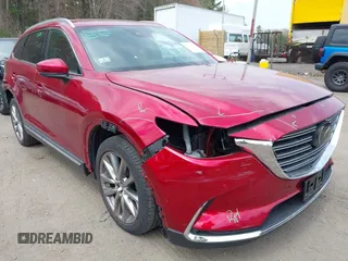 2019 Mazda CX-9 Grand Touring z VIN JM3TCBDY8K0333394, wystawiony jako IAAI lot #42109778 z przebiegiem 58 887 mil mil oraz . Historia ofert i sprzedaży dostępna na DreamBid. Obrazek 1.