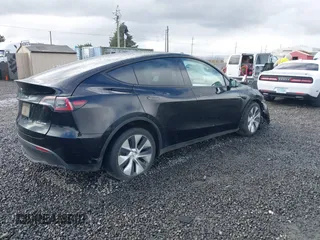 2022 Tesla Model Y Long Range z VIN 7SAYGDEE4NF447985, wystawiony jako IAAI lot #41811782 z przebiegiem 81 973 mil mil oraz . Historia ofert i sprzedaży dostępna na DreamBid. Obrazek 4.
