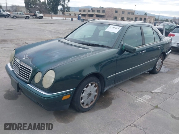 1997 Mercedes-Benz E-Class with VIN WDBJF55F3VJ034009, listed as a IAAI auction lot 41710225 with 239,673 mi miles. Bid and sale history available at carsss.com. Image 2.