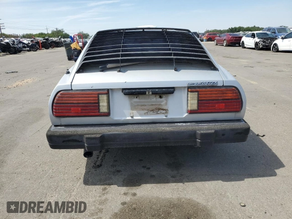 1982 Datsun 280ZX z VIN JN1HZ04SXCX448748, wystawiony jako Copart lot #87670125 z przebiegiem 136 264 mil mil oraz Szkody całkowita. Historia ofert i sprzedaży dostępna na DreamBid. Obrazek 6.