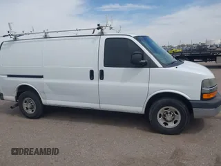 2012 Chevrolet Express Cargo Van with VIN 1GCWGFCA7C1121989, listed as a IAAI auction lot 42118853 with 214,478 mi miles. Bid and sale history available at carsss.com. Image 13.