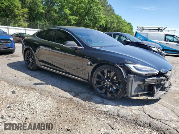 2017 Tesla Model S 100D with VIN 5YJSA1E28HF192397, listed as a Copart auction lot 55455995 with 90,534 mi miles and Salvage title. Bid and sale history available at DreamBid. Image 4.
