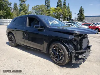 2024 BMW iX xDrive50 with VIN WB523CF05RCN96948, listed as a Copart auction lot 50858304 with 8,923 mi miles and Salvage Title. Bid and sale history available at carsss.com. Image 4.