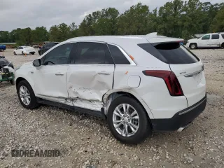 2024 Cadillac XT5 FWD Luxury with VIN 1GYKNAR4XRZ747310, listed as a Copart auction lot 55598585 with 14,371 mi miles and Salvage title. Bid and sale history available at DreamBid. Image 2.