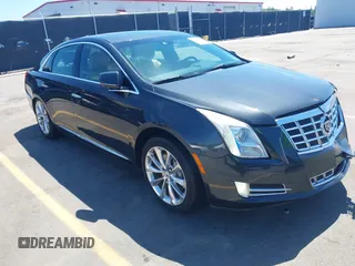 2013 Cadillac XTS Premium z VIN 2G61S5S39D9100602, wystawiony jako IAAI lot #42171870 z przebiegiem 164 016 mil mil oraz . Historia ofert i sprzedaży dostępna na DreamBid. Obrazek 1.