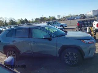 2023 Toyota RAV4 Hybrid XLE Premium with VIN JTMB6RFV3PD116696, listed as a IAAI auction lot 42044933 with 18,553 mi miles. Bid and sale history available at carsss.com. Image 13.
