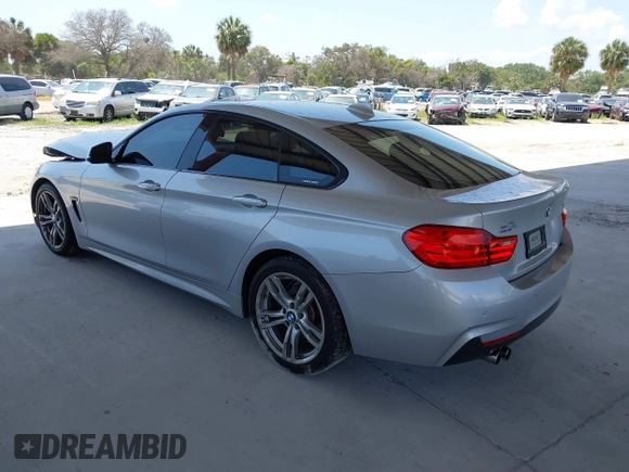 2015 BMW 4 Series 428i with VIN WBA4A5C58FD410076, listed as a IAAI auction lot 39384271 with 125,987 mi miles and . Bid and sale history available at DreamBid. Image 3.