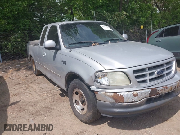 2001 Ford F-150 with VIN 2FTZX17221CB01390, listed as a IAAI auction lot 42194407 with 239,834 mi miles and . Bid and sale history available at DreamBid. Image 1.