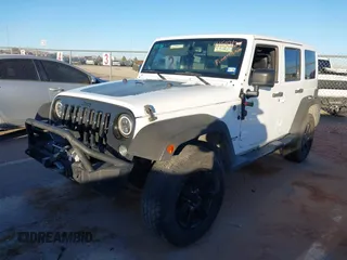 2014 Jeep Wrangler Unlimited Sahara with VIN 1C4BJWEG0EL273475, listed as a IAAI auction lot 41515425 with 128,900 mi miles. Bid and sale history available at carsss.com. Image 17.