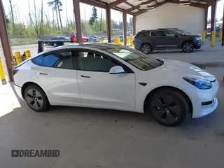 2023 Tesla Model 3 with VIN 5YJ3E1EA5PF610431, listed as a IAAI auction lot 42087181 with 19,777 mi miles and . Bid and sale history available at carsss.com. Image 13.