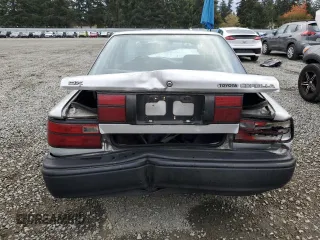 1991 Toyota Corolla z VIN 1NXAE94A8MZ234510, wystawiony jako Copart lot #75002404 z przebiegiem 188 051 mil mil oraz Szkoda całkowita • Salvage title. Historia ofert i sprzedaży dostępna na DreamBid. Obrazek 6.