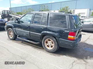 1996 Jeep Grand Cherokee Limited z VIN 1J4GZ78Y3TC191000, wystawiony jako IAAI lot #42259621 z przebiegiem 212 690 mil mil oraz . Historia ofert i sprzedaży dostępna na DreamBid. Obrazek 3.