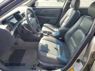 2000 Toyota Camry LE z VIN JT2BF28K5Y0261315, wystawiony jako Copart lot #59607935 z przebiegiem 87 184 mil mil oraz Szkoda całkowita • Salvage title. Historia ofert i sprzedaży dostępna na DreamBid. Obrazek 7.