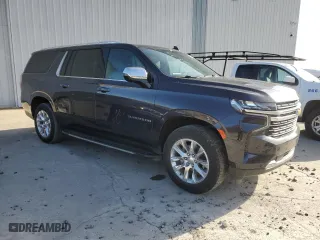2023 Chevrolet Suburban Premier with VIN 1GNSCFKD5PR394675, listed as a Copart auction lot 49641395 with 56,946 mi miles and Salvage Title. Bid and sale history available at carsss.com. Image 4.