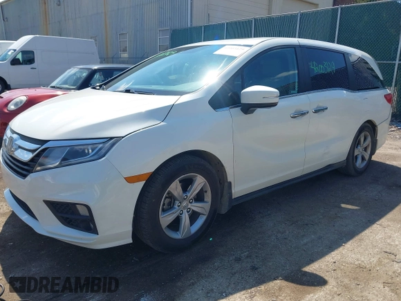 2018 Honda Odyssey EX-L z VIN 5FNRL6H70JB102713, wystawiony jako IAAI lot #42003129 z przebiegiem 410 500 mil mil oraz . Historia ofert i sprzedaży dostępna na DreamBid. Obrazek 2.