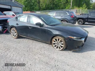 2021 Mazda 3 Premium with VIN 3MZBPADL2MM254467, listed as a IAAI auction lot 42151557 with 63,282 mi miles and . Bid and sale history available at DreamBid. Image 1.