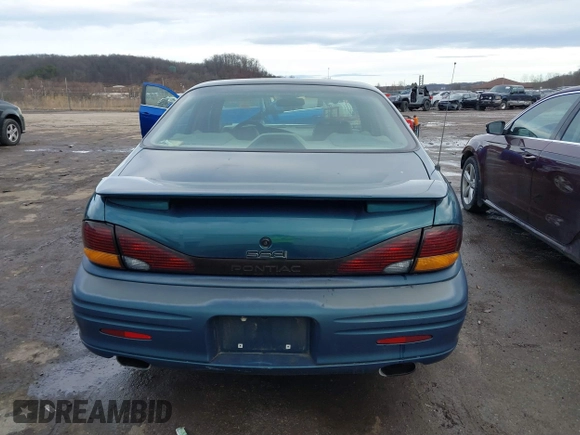 1996 Pontiac Bonneville z VIN 1G2HZ5210TH210829, wystawiony jako IAAI lot #41203888 z przebiegiem 154 990 mil mil oraz . Historia ofert i sprzedaży dostępna na DreamBid. Obrazek 16.