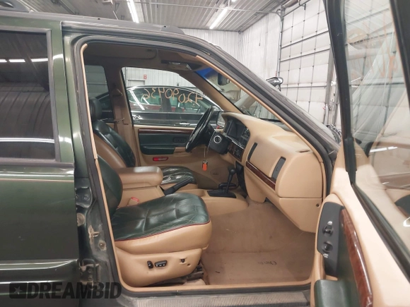 1997 Jeep Grand Cherokee Limited with VIN 1J4GZ78Y0VC684023, listed as a IAAI auction lot 42090436 with 310,831 mi miles. Bid and sale history available at carsss.com. Image 5.