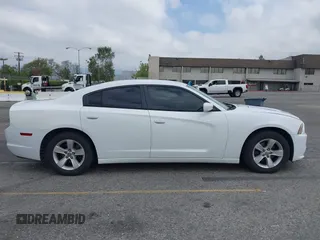 2014 Dodge Charger SE with VIN 2C3CDXBG3EH131242, listed as a IAAI auction lot 42121260 with 231,452 mi miles and . Bid and sale history available at DreamBid. Image 13.