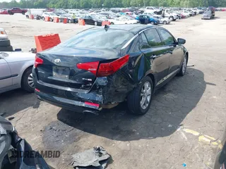 2013 Kia Optima EX z VIN 5XXGN4A71DG184078, wystawiony jako IAAI lot #42124359 z przebiegiem 196 389 mil mil oraz . Historia ofert i sprzedaży dostępna na DreamBid. Obrazek 4.
