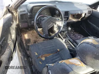 1982 Toyota Supra z VIN JT2MA67LXC0032341, wystawiony jako Copart lot #49951115 z przebiegiem 76 389 mil mil oraz Czysty tytuł • Clean title. Historia ofert i sprzedaży dostępna na DreamBid. Obrazek 8.