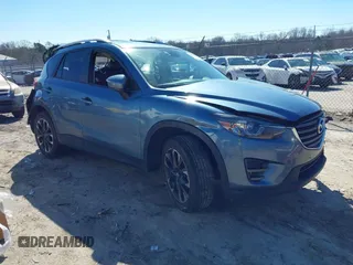 2016 Mazda CX-5 Grand Touring with VIN JM3KE2DY2G0715272, listed as a IAAI auction lot 41590492 with 134,176 mi miles. Bid and sale history available at carsss.com. Image 1.