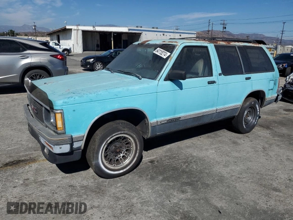 1991 GMC Jimmy z VIN 1GKCS13Z2M2518231, wystawiony jako Copart lot #64115274 z przebiegiem 132 698 mil mil oraz Czysty tytuł • Clean title. Historia ofert i sprzedaży dostępna na DreamBid. Obrazek 1.