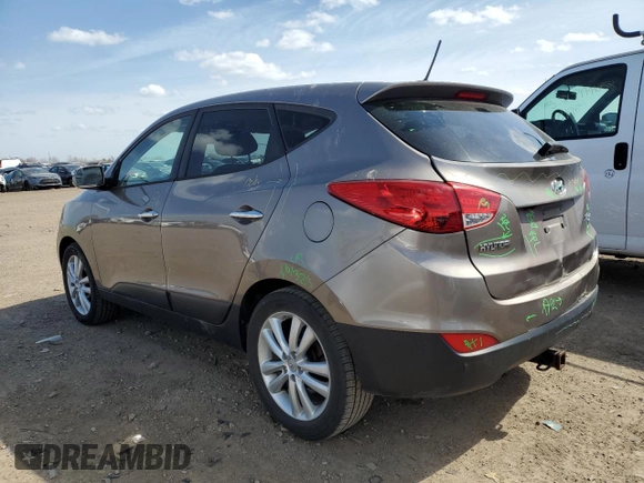 2010 Hyundai Tucson GLS with VIN KM8JU3AC8AU056499, listed as a Copart auction lot 53057365 with 119,906 mi miles and Salvage Title. Bid and sale history available at DreamBid. Image 2.