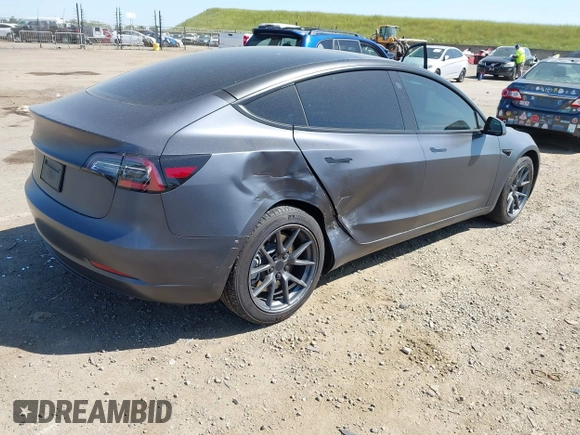 2023 Tesla Model 3 z VIN 5YJ3E1EA2PF404614, wystawiony jako IAAI lot #42009539 z przebiegiem 22 105 mil mil oraz . Historia ofert i sprzedaży dostępna na DreamBid. Obrazek 4.