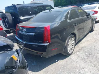 2011 Cadillac CTS Premium with VIN 1G6DS5ED4B0105859, listed as a IAAI auction lot 42494741 with 143,128 mi miles and . Bid and sale history available at DreamBid. Image 4.