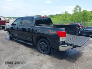 2013 Toyota Tundra with VIN 5TFDW5F12DX305493, listed as a IAAI auction lot 42265066 with 192,462 mi miles and . Bid and sale history available at DreamBid. Image 3.
