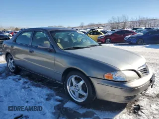 2001 Mazda 626 LX with VIN 1YVGF22C315225141, listed as a Copart auction lot 42004475 with 195,643 mi miles and Salvage Title. Bid and sale history available at carsss.com. Image 4.