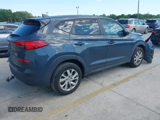 2021 Hyundai Tucson SE with VIN KM8J23A48MU379826, listed as a IAAI auction lot 41887834 with 51,885 mi miles and . Bid and sale history available at DreamBid. Image 4.