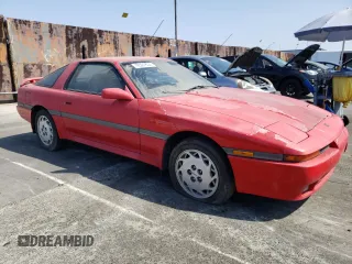 1989 Toyota Supra z VIN JT2MA70J3K0114537, wystawiony jako Copart lot #72587854 z przebiegiem 189 813 mil mil oraz Czysty tytuł • Clean title. Historia ofert i sprzedaży dostępna na DreamBid. Obrazek 4.