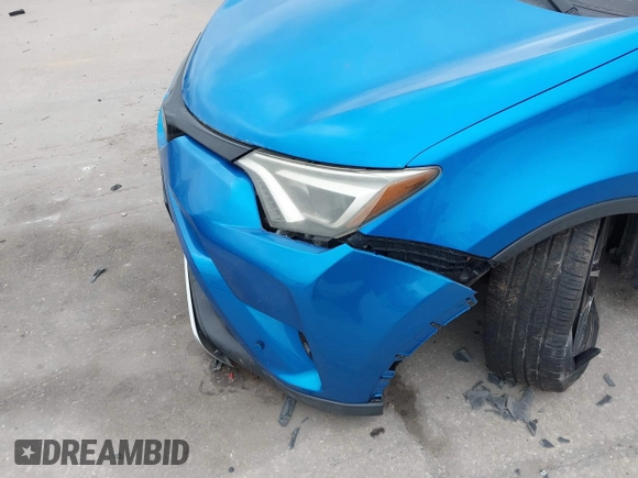 2016 Toyota RAV4 SE with VIN JTMJFREV3GJ076876, listed as a IAAI auction lot 41566899 with 133,216 mi miles and . Bid and sale history available at DreamBid. Image 6.