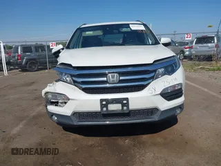 2018 Honda Pilot Touring with VIN 5FNYF6H95JB019122, listed as a IAAI auction lot 42439283 with 128,848 mi miles and . Bid and sale history available at DreamBid. Image 12.