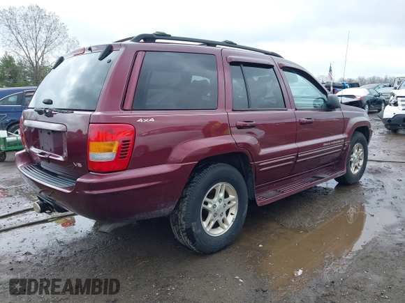 1999 Jeep Grand Cherokee Limited with VIN 1J4GW68N5XC642670, listed as a IAAI auction lot 41990199 with 154,492 mi miles. Bid and sale history available at carsss.com. Image 4.